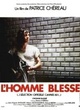 Affiche du film L'homme blessé