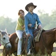 miley cyrus and lucas till on a horse