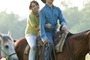 miley cyrus and lucas till on a horse